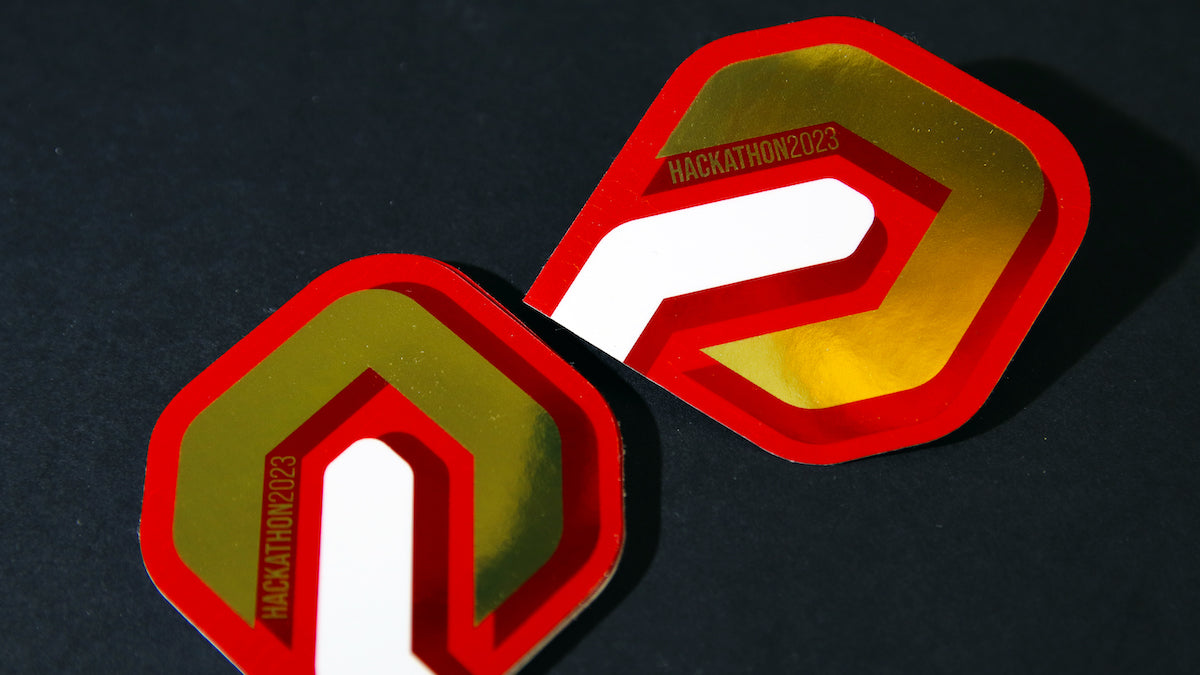 2023 hackathon logo printed on mirror gold material