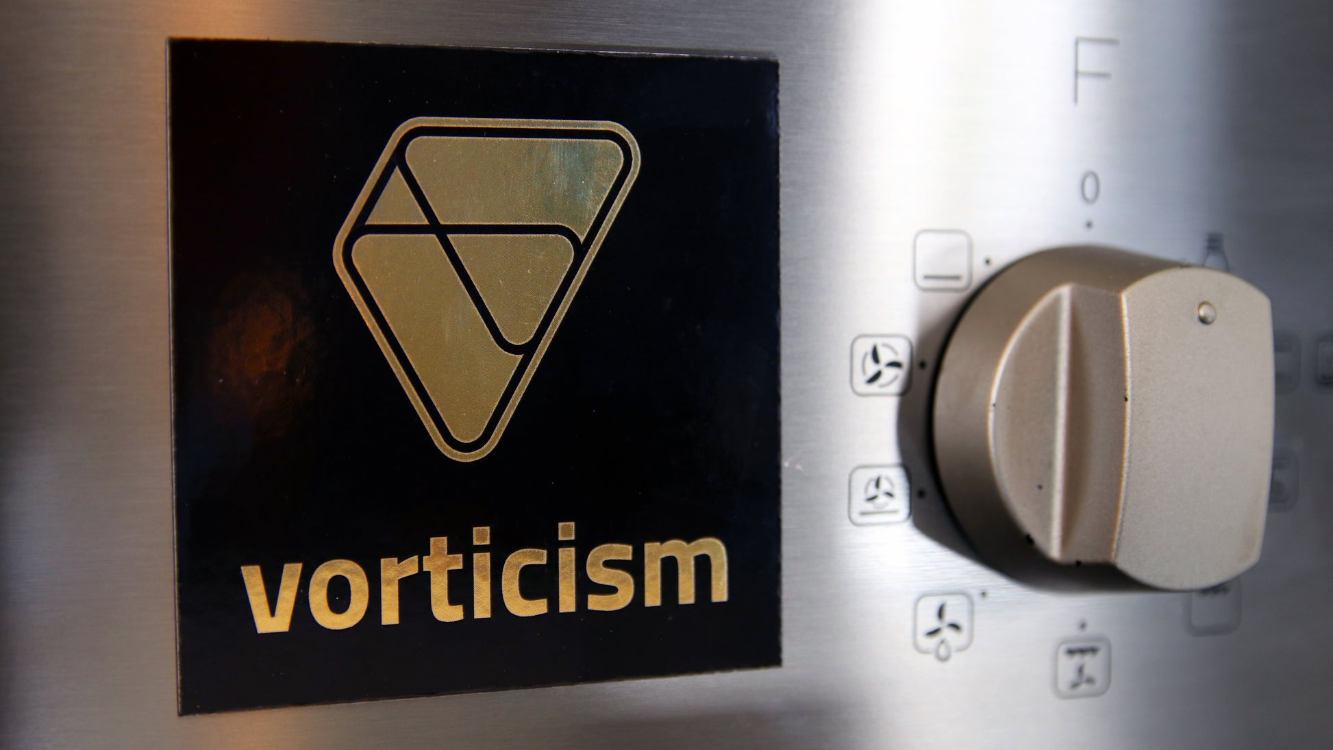 Square magnet printed on gold material with Vorticism design