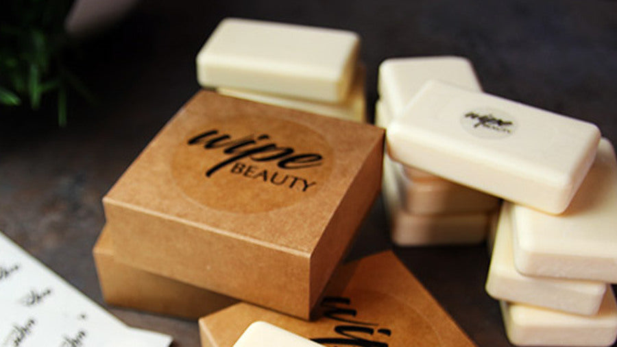 Circle clear stickers applied to cardboard soap boxes