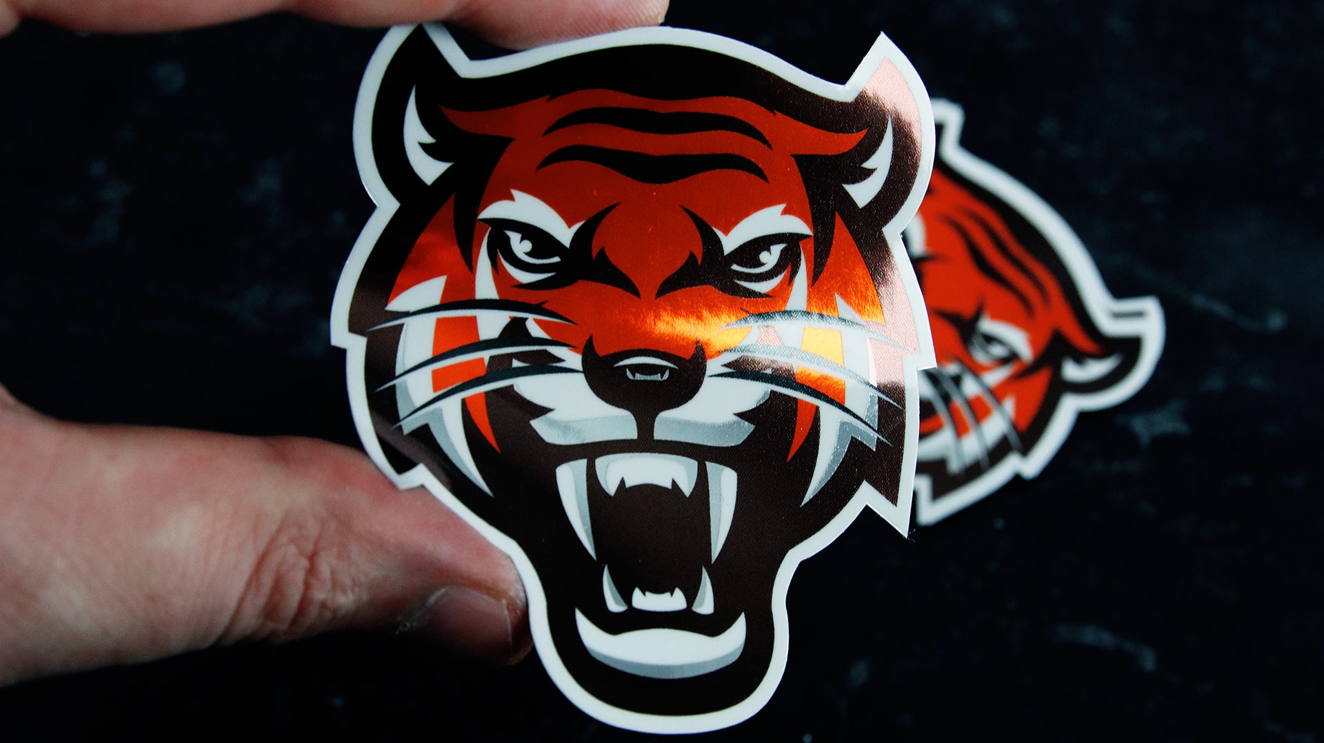 Die cut mirror silver vinyl sticker with tiger design hand held