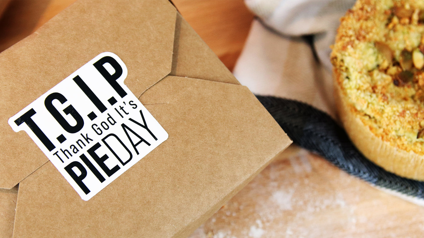 Die cut white vinyl bakery label with TGIP design applied to a cardboard food box