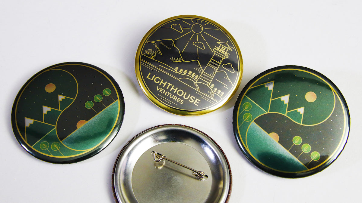 Mixed illustration designs for promotional badges on metallic gold 58mm (2.25 inch) sizes