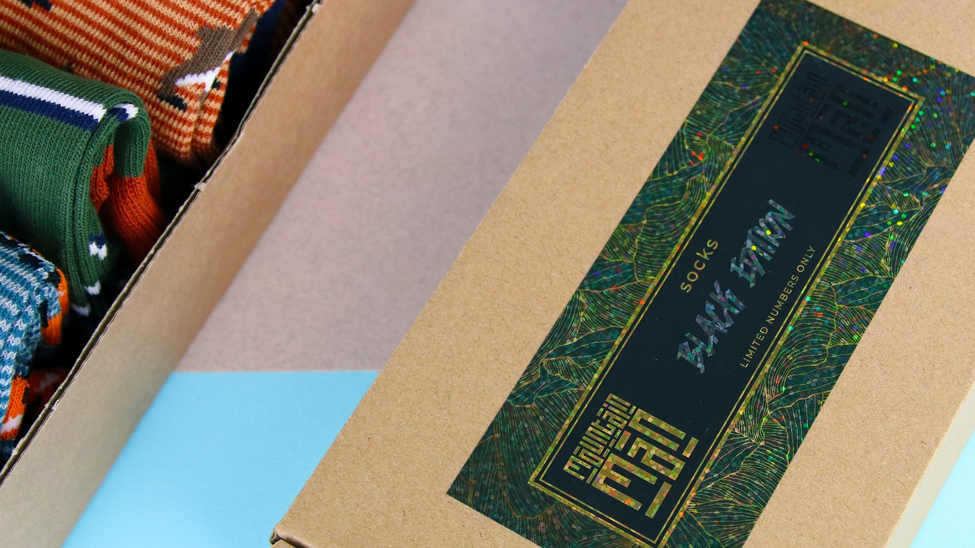 Mountain man socks branded glitter rectangle label applied to a box