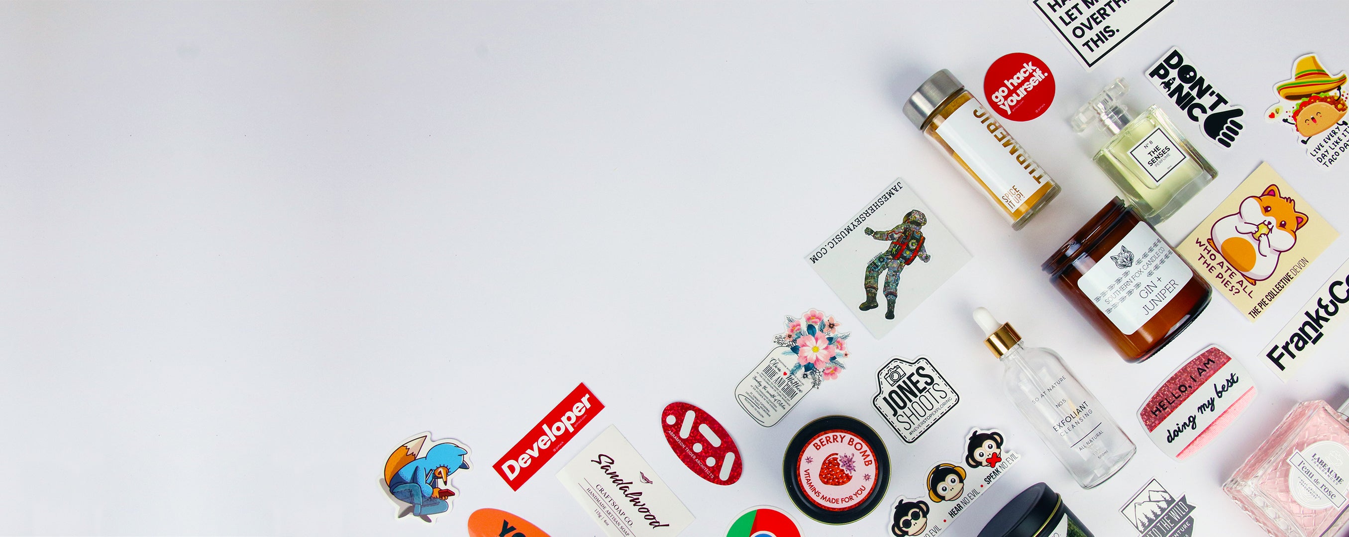 Various stickers some applied, some stacked on white background