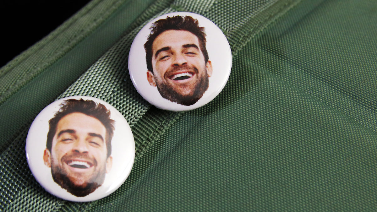 Very happy man face badge on a white background 32mm in size