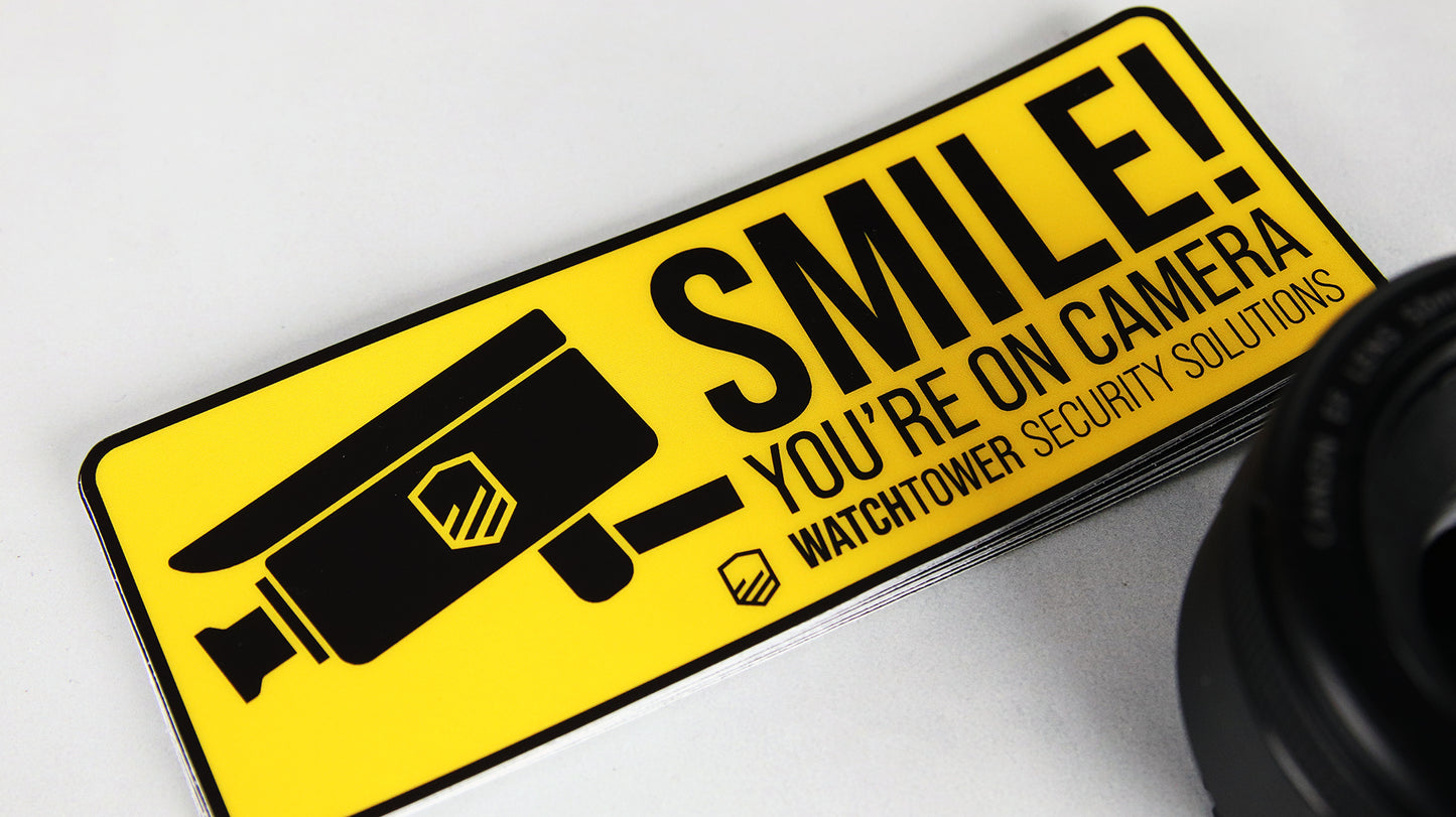 Rounded corner heavy duty sticker with CCTV design on bright yellow