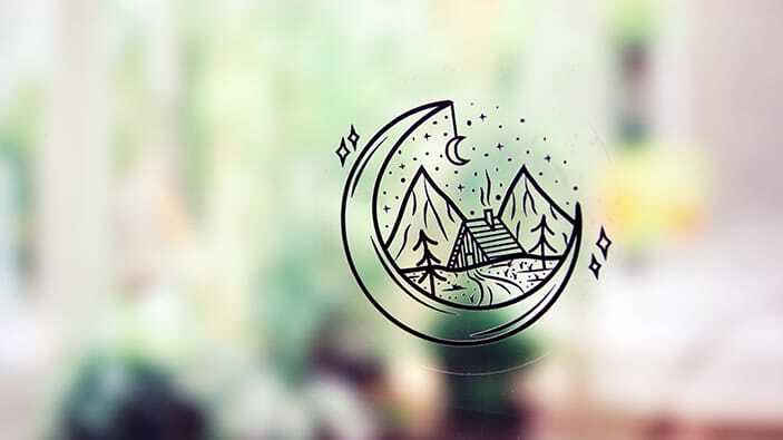 Circle static cling sticker with line art design applied to a window