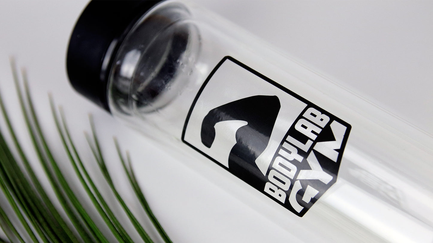 Clear label applied to a glass water bottle