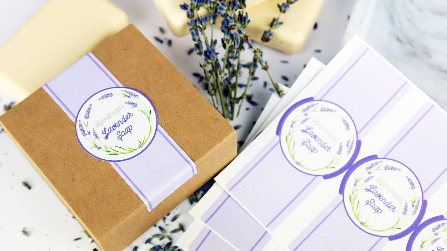 Die-cut biodegradable paper packaging labels applied to a cardboard box filled with lavender soap