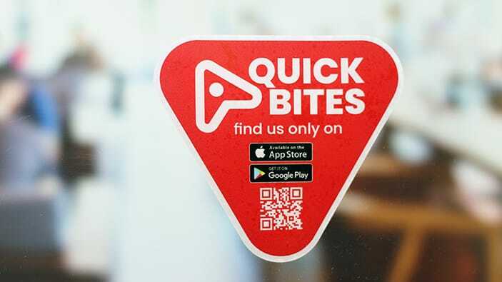 Die cut static window cling with quick bites design applied to a window