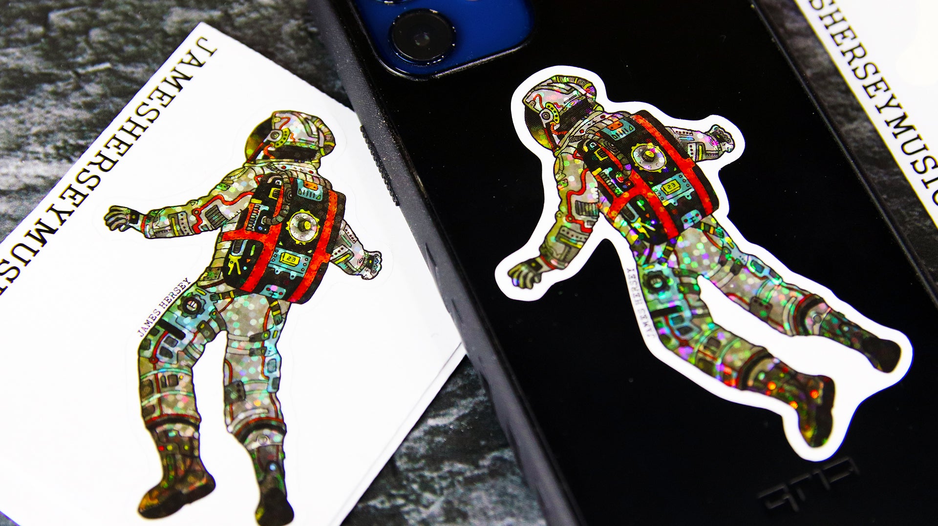 Kiss cut glitter samples with James Hersey logo applied to a black phone