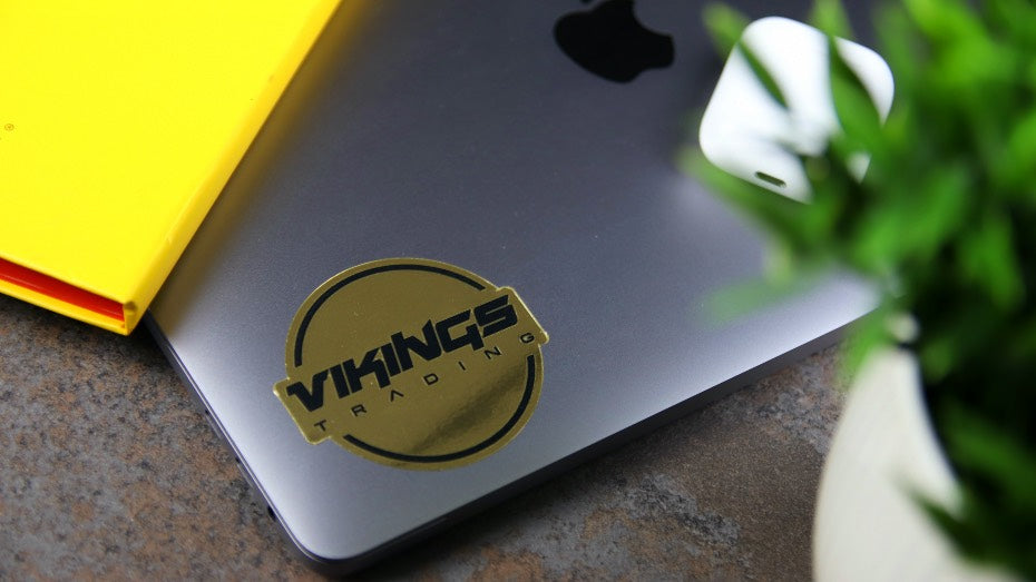 Mirror gold die cut sticker sample applied to a laptop