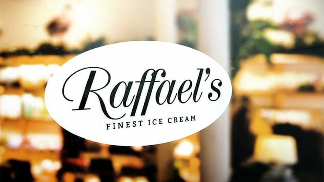 Oval front adhesive sticker with ice cream design applied to a window