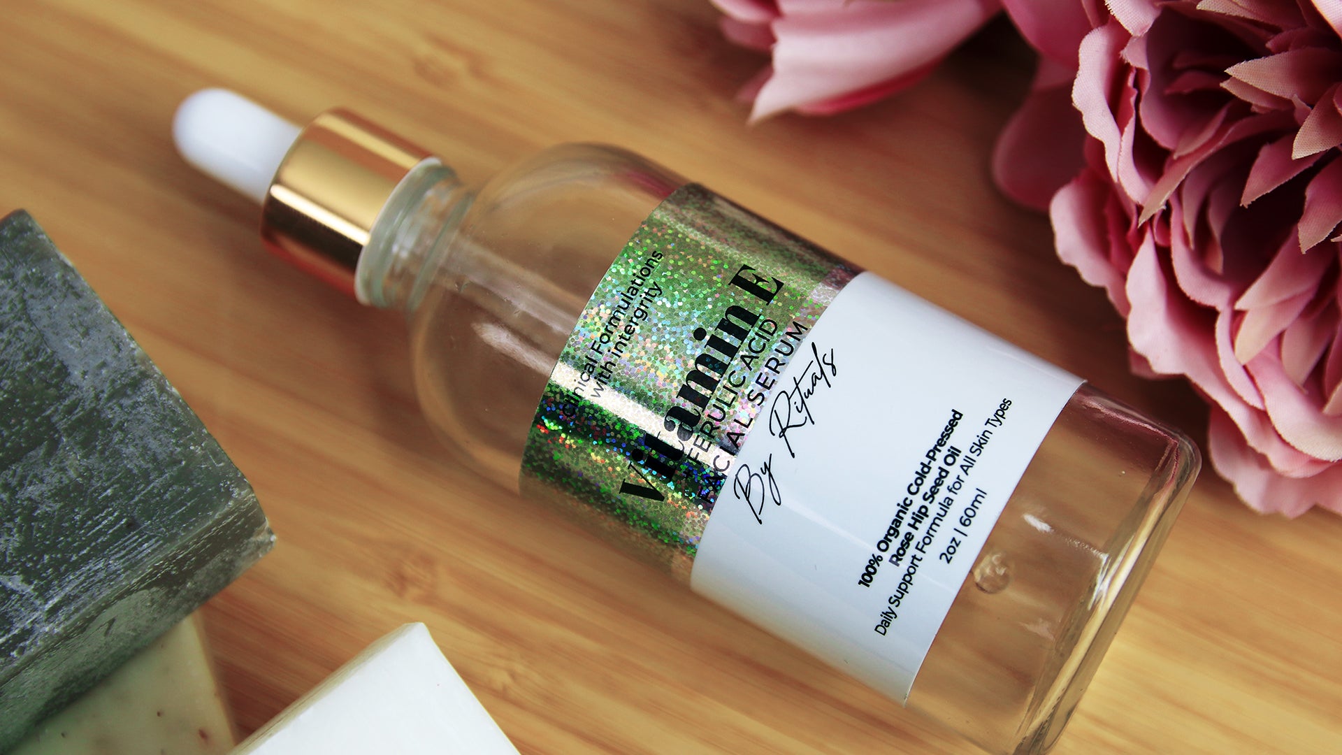 Rectangle eco-friendly glitter sticker with vitamin e design applied to a glass bottle