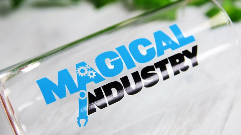 Rectangular transparent water bottle label with logo applied to a clear water bottle