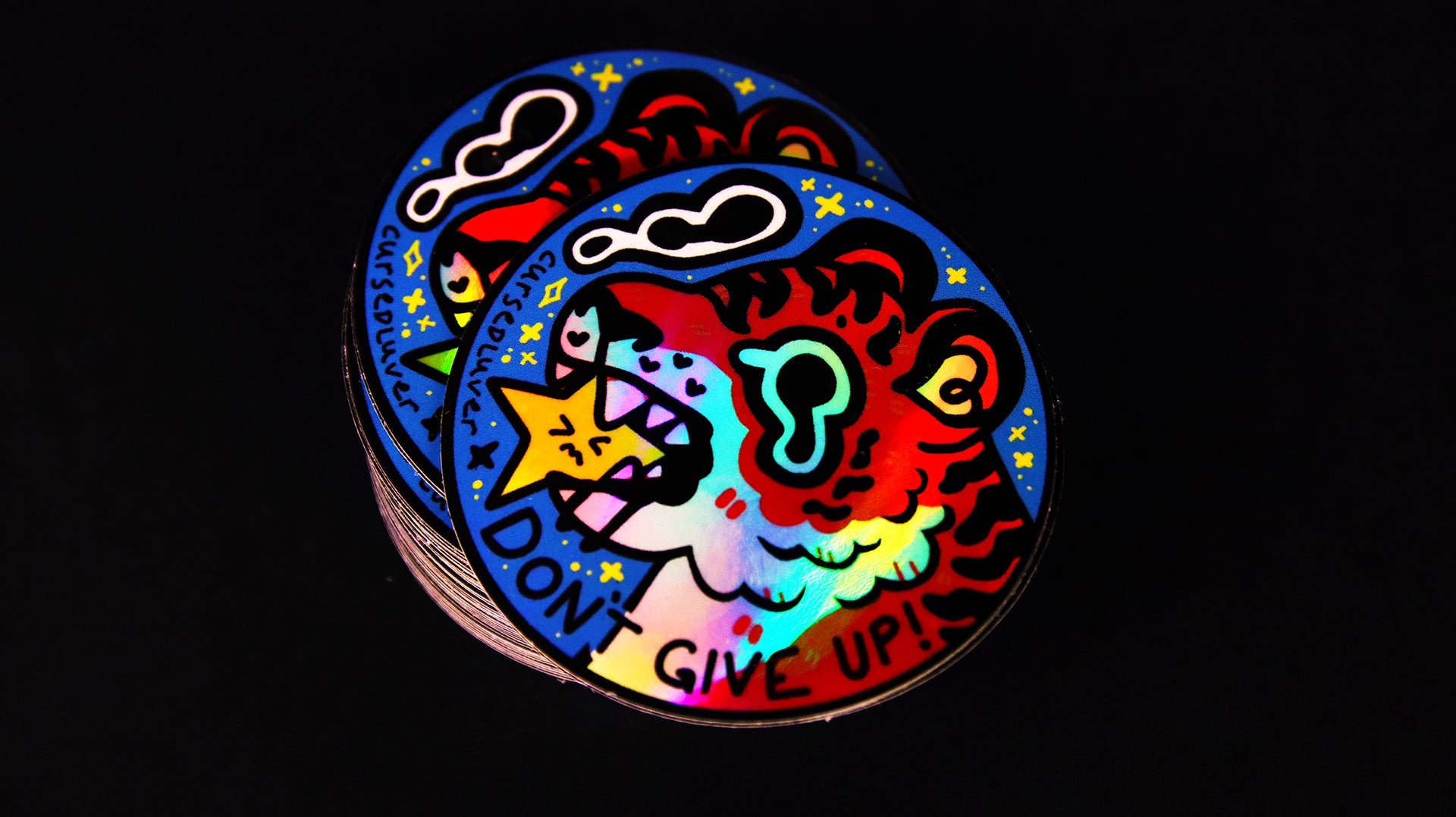 Round holographic sticker with tiger against a black background