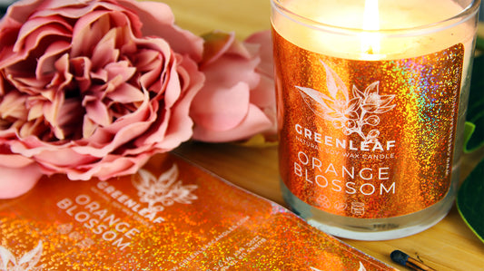 Rounded corner eco-friendly glitter labels with one label applied to a candle