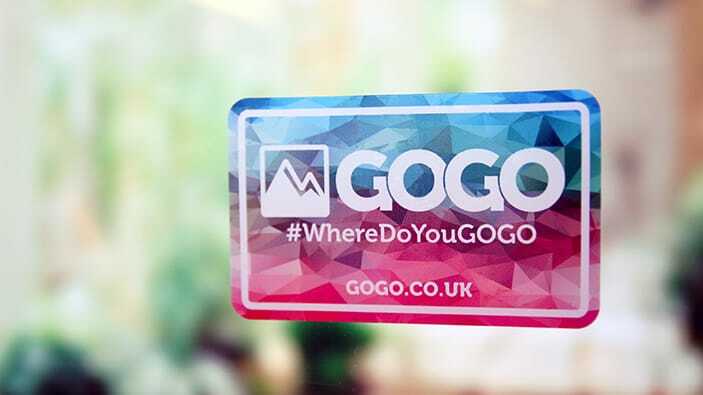 Rounded corner static cling sticker with gogo logo applied to a window