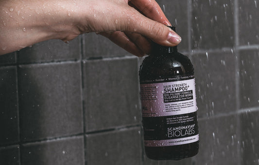 Shampoo label applied to a bottle in the shower