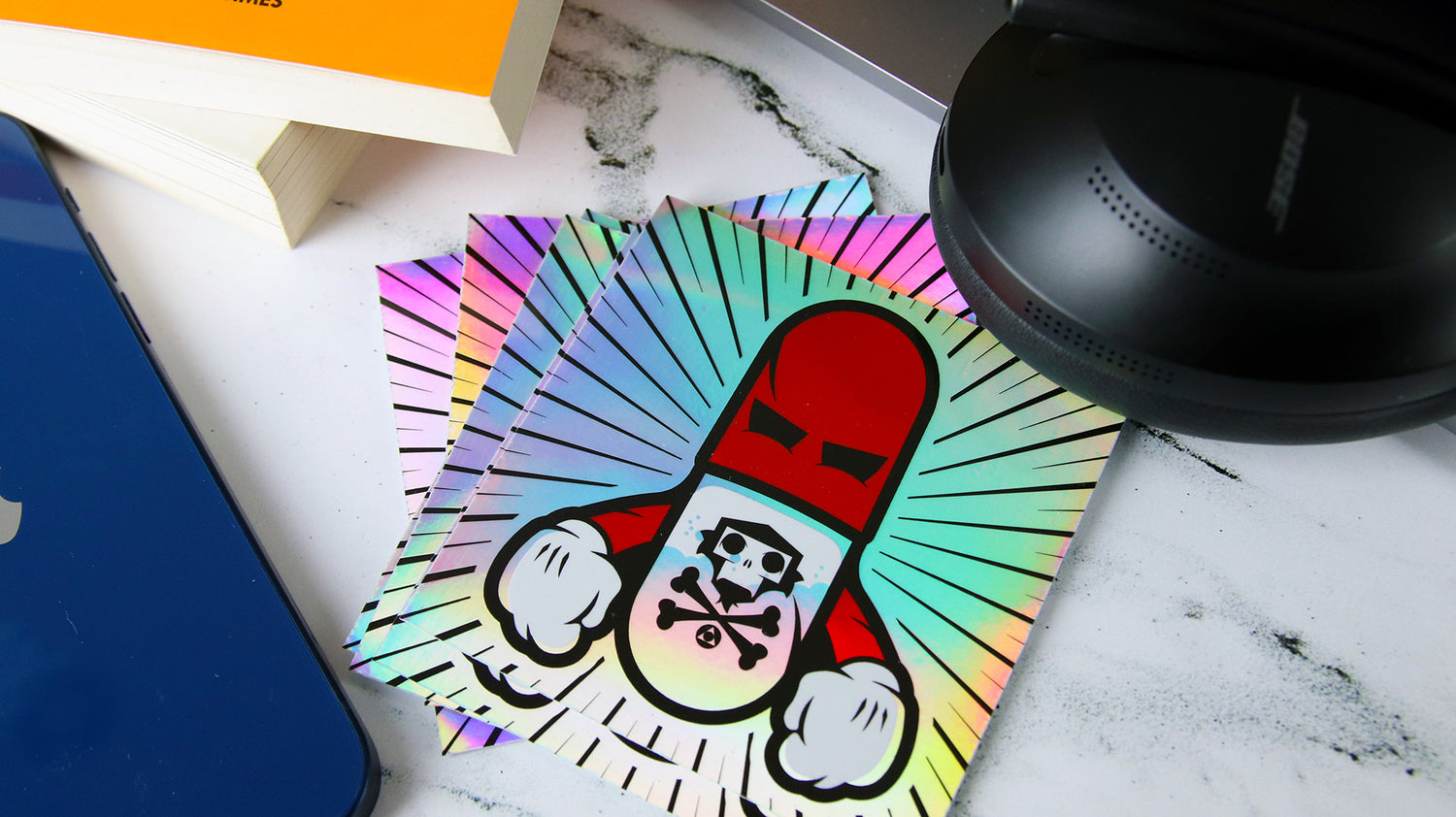 Square holographic sample with pillman design on a table top