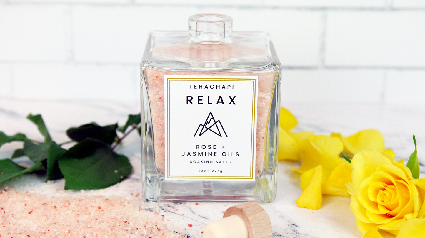 Square white vinyl samples applied to a bath salts bottle