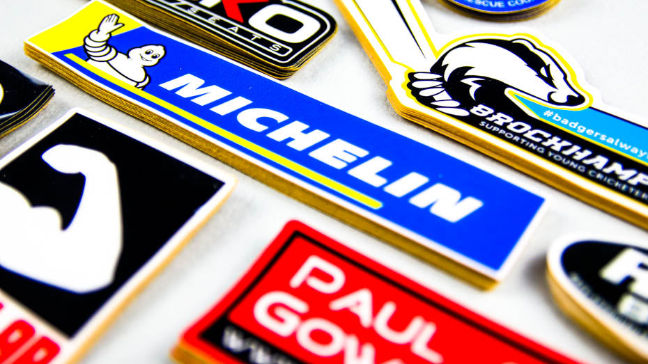 Piles of heavy duty stickers on a grey background