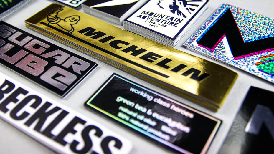 Piles of rectangle stickers on a light grey table