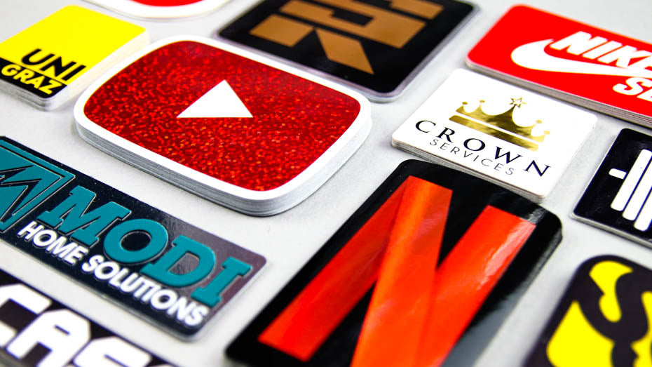 Piles of rounded corner stickers on a light grey table