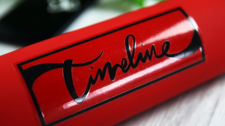 Transparent rectangle sticker applied to red water bottle