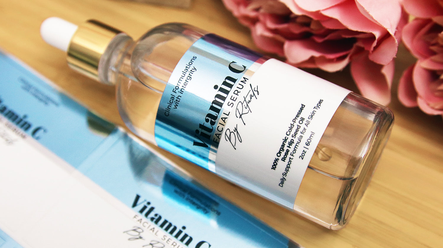 Rectangle silver labels with vitamin c design with one label applied to a glass bottle