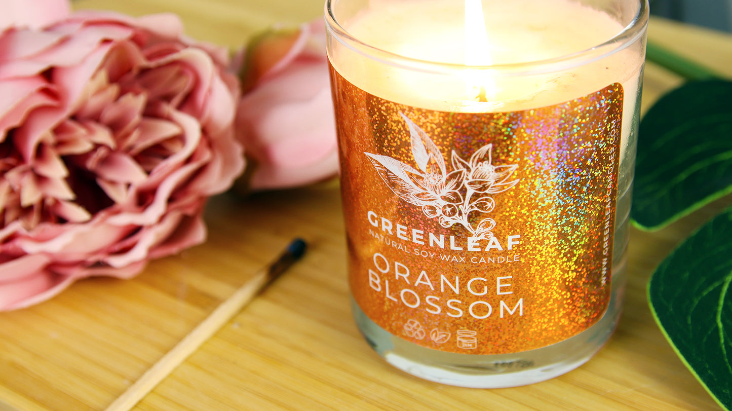 Rounded corner eco-friendly glitter sticker applied to a candle